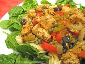 Warm Mediterranean Chicken Salad on Spinach